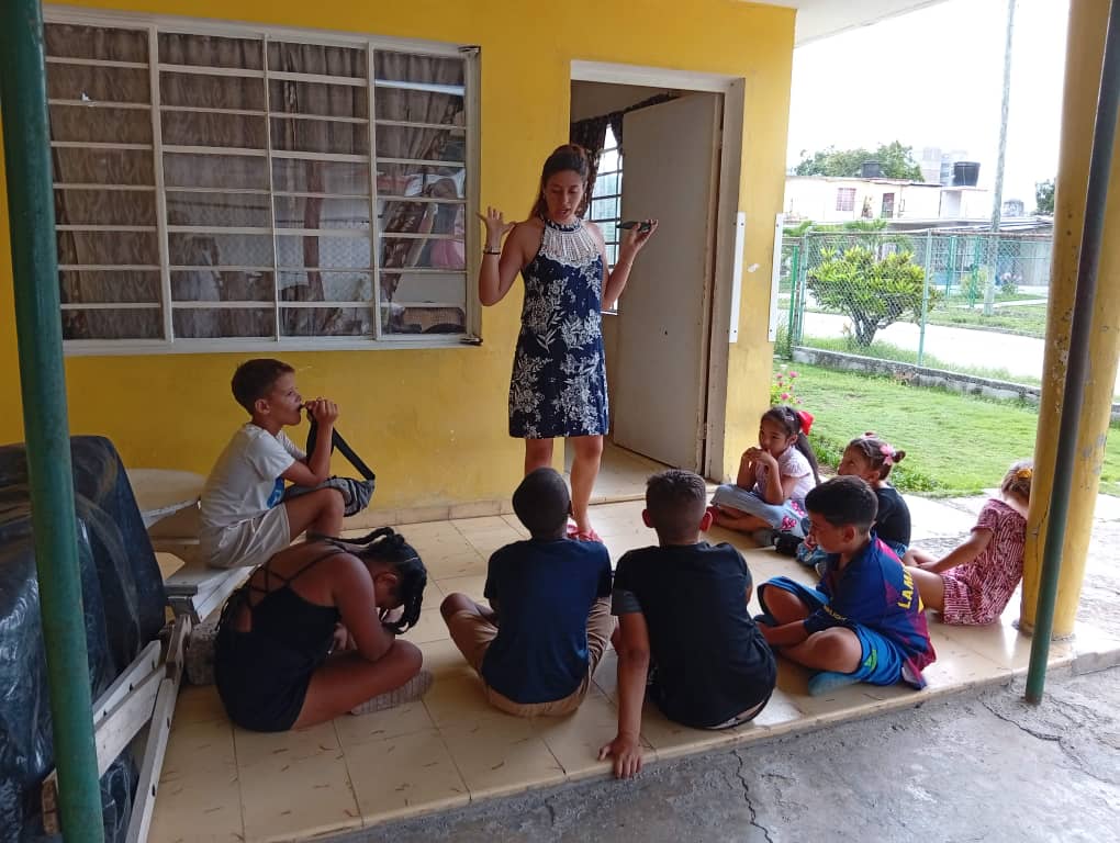 Adult teaching children